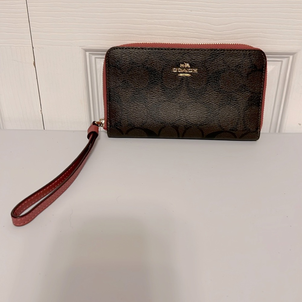 EUC Coach Signature Wristlet 6 1/2” x 4”. Dark Brown & Pink with 6” strap.